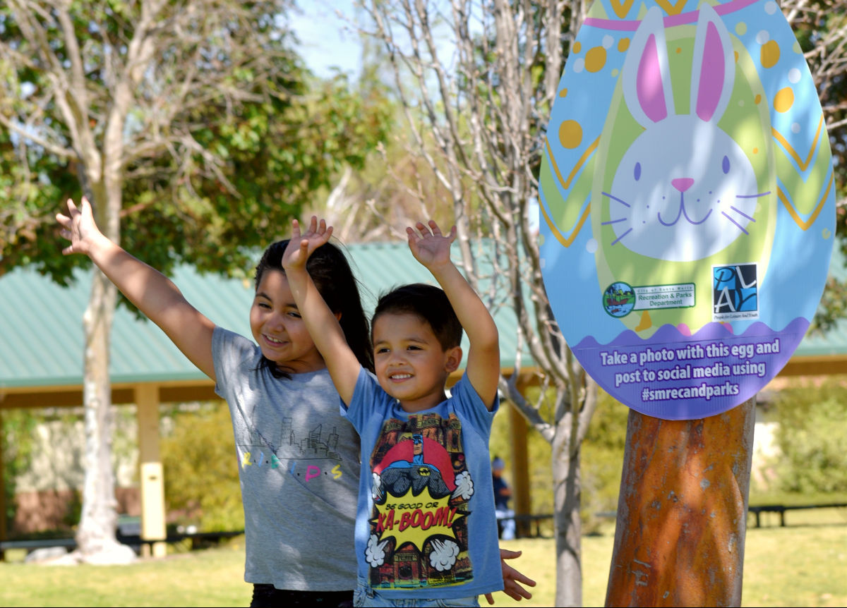 Marla and Roberto Ibarra celebrate by hidden Easter egg at Rotary Park in Santa Maria Friday.